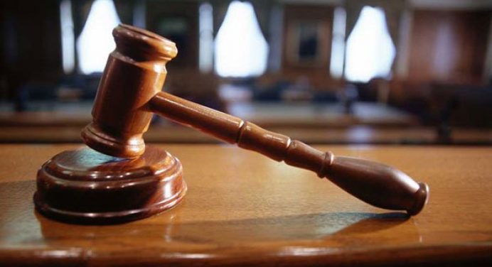 U.S. Court Dismisses Apple's Patent Lawsuit against Motorola - Gavel Placed On Top Of The Table - Droid Views