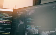 Two computer screens with code