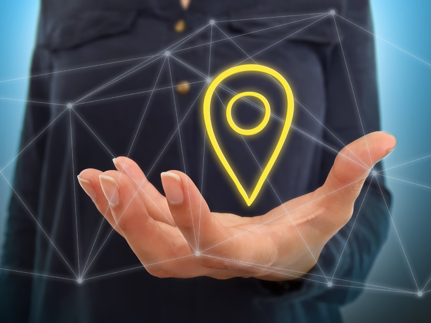 Man's open hand with a localisation icon hovering above it.