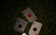Playing cards in the air to represent Solitaire